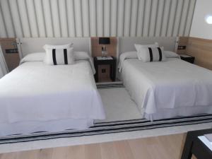 Кровать или кровати в номере Gran Hotel Sardinero