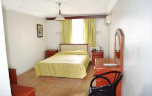 Ein Bett oder Betten in einem Zimmer der Unterkunft Yunus Hotel