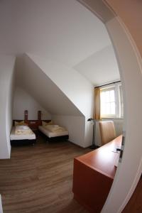 Postel nebo postele na pokoji v ubytování Hotel Goldene Krone