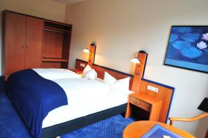 Postel nebo postele na pokoji v ubytování Hotel Goldene Krone