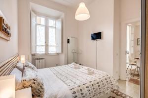 Ένα ή περισσότερα κρεβάτια σε δωμάτιο στο La casa di Nonna Pina
