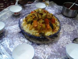 a table with a plate of food on a table at Azur Tafraout in Tafraoute