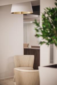 Posezení v ubytování Essence Inn Marianos Hotel