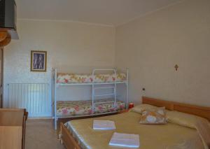 A bed or beds in a room at Casa Lieta