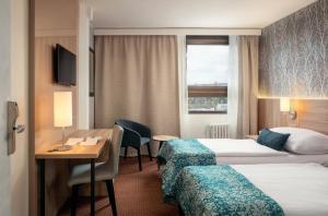 Postel nebo postele na pokoji v ubytování Congress & Wellness Hotel Olsanka