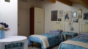 A bed or beds in a room at Agriturismo Sorgente di Luna