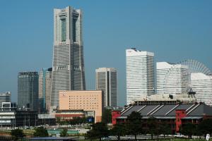 a city skyline with tall buildings in a city at Navios Yokohama in Yokohama