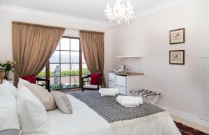 Postel nebo postele na pokoji v ubytování Moncrieff Manor