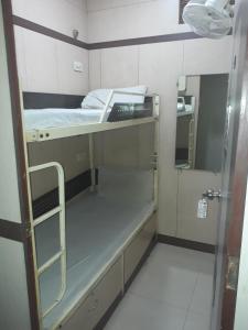 
A bunk bed or bunk beds in a room at Apollo Guest House
