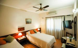 Ένα ή περισσότερα κρεβάτια σε δωμάτιο στο Hotel Palmar