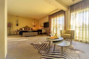 a living room with a zebra patterned rug at Congo Palace in Athens