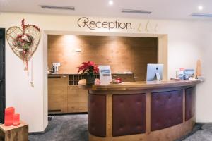 an office with a reception desk and a counter at Hotel Waldcafe in Sölden