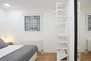 מיטה או מיטות בחדר ב-LEEWAYS APARTMENT in SAN LORENZO