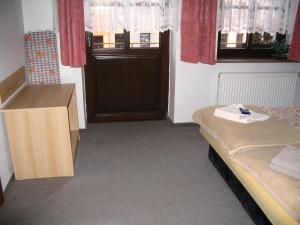 Postel nebo postele na pokoji v ubytování Apartmany Ingeborg