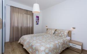 Postel nebo postele na pokoji v ubytování Apartments Matea I