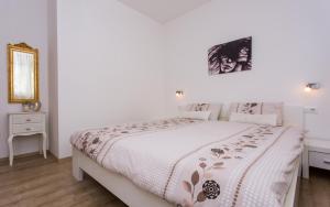 Postel nebo postele na pokoji v ubytování Apartments Matea I