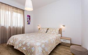 Postel nebo postele na pokoji v ubytování Apartments Matea I