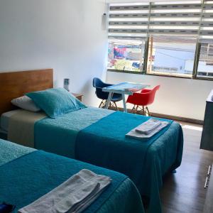 Postel nebo postele na pokoji v ubytování El Camino Hotel