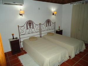 Postel nebo postele na pokoji v ubytování Monte da Avó Chica