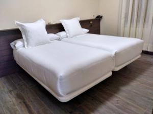 Voodi või voodid majutusasutuse Valle Del Eria Hotel toas