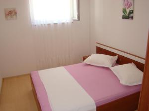 Postel nebo postele na pokoji v ubytování Apartments Ada