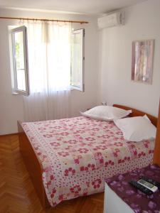 Postel nebo postele na pokoji v ubytování Apartments Ada