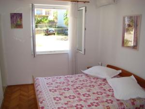 Postel nebo postele na pokoji v ubytování Apartments Ada
