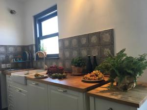 a kitchen with a counter with fruits on it at B&B Francisca in Tortolì