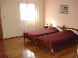 A bed or beds in a room at Zephyros