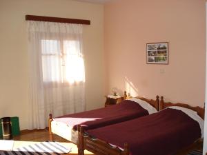 A bed or beds in a room at Zephyros