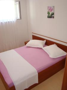 Postel nebo postele na pokoji v ubytování Apartments Ada