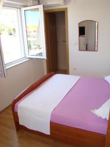 Postel nebo postele na pokoji v ubytování Apartments Ada