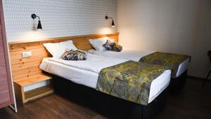 Кровать или кровати в номере Лыжа