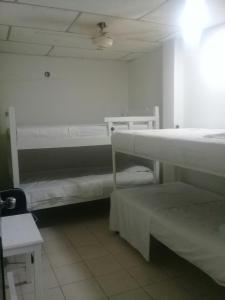 Hotel Paseo Bolivar客房内的一张或多张床位