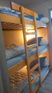 a bunk bed with four bunk beds in a room at Studio Chatel in Châtel