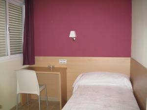 Postel nebo postele na pokoji v ubytování Hostal Ducal