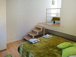 a room with a bed with two towels on it at Apartment Ana Marija Savar in Savar
