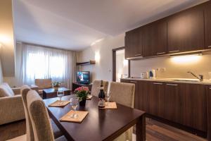 Cuisine ou kitchenette dans l'établissement Aparthotel Aspen