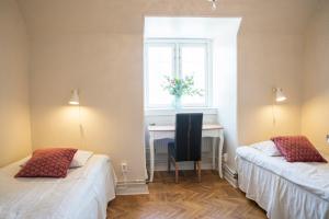 Katil atau katil-katil dalam bilik di Halmstad Hotell & Vandrarhem Kaptenshamn
