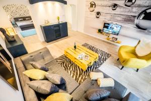 an overhead view of a living room with a couch and a table at BpR CarpeDiem Dream Home in Budapest