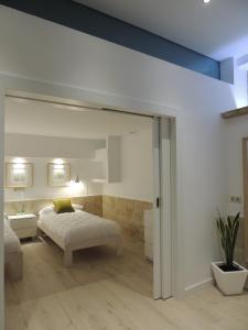Posteľ alebo postele v izbe v ubytovaní Apartamento Ribera Del Puente