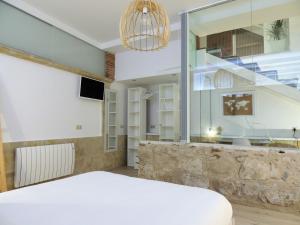 Posteľ alebo postele v izbe v ubytovaní Apartamento Ribera Del Puente