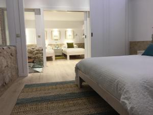 Tempat tidur dalam kamar di Apartamento Ribera Del Puente