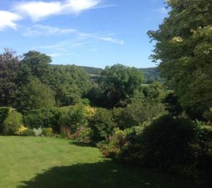 an aerial view of a garden with trees and bushes at Dove Lodge in Painswick