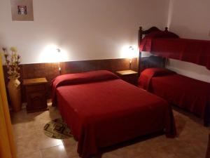 Hostería Cuarajhy Loreto tesisinde bir odada yatak veya yataklar