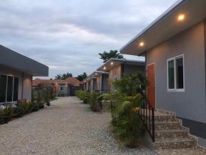 a row of houses with stairs next to them at Baan Phu Jad Kan in Uttaradit
