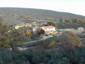 an aerial view of a house on a hill at Hotel El Molino in Congosta