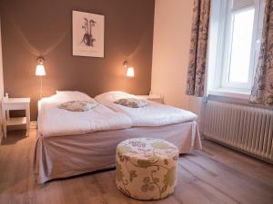 Postel nebo postele na pokoji v ubytování Hotel Åberg Centralhotellet