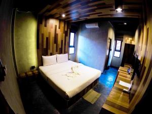 Een bed of bedden in een kamer bij Baan Kon Pai