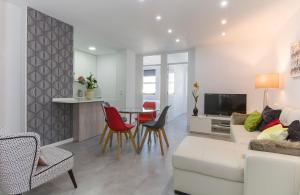 a living room with a couch and a table at Plaza España & Gran Via 2BD 1BTH in Madrid